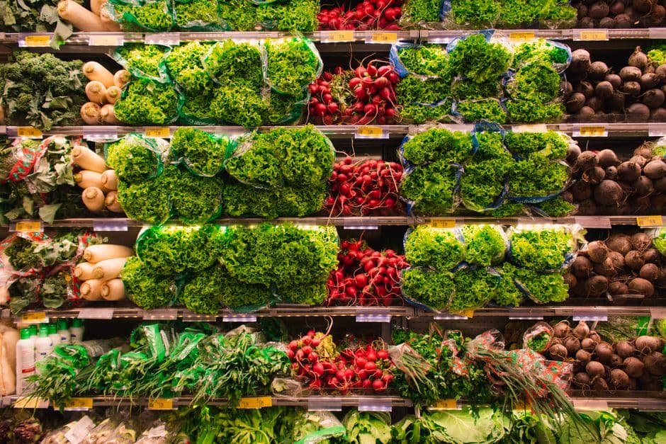 Fresh produce in a supermarket aisle