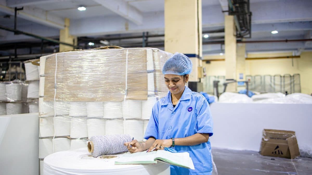 Food safety professional reviewing HACCP documents in a food production setting